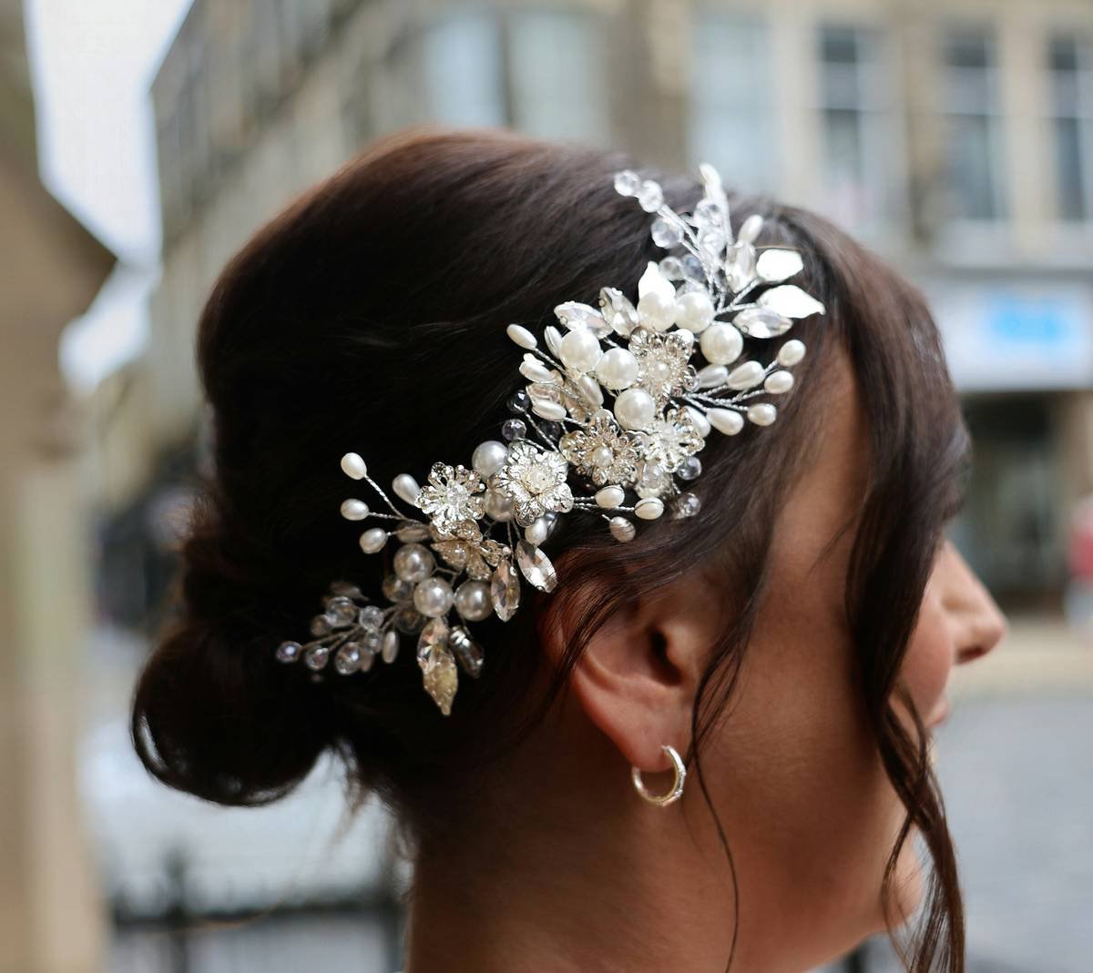 Side-by-side comparison showing crystal hair pins holding thick curly hair vs. standard clip slipping